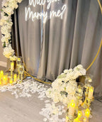 Floral Marry Me Proposal Setup with Neon Sign