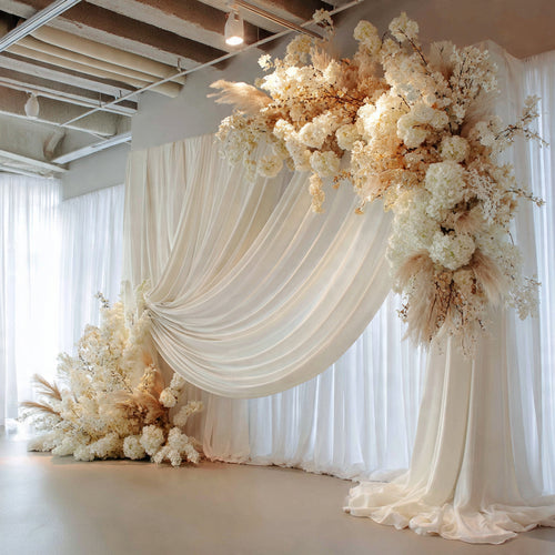 Elegant Ivory Drapes & Floral Statement Backdrop
